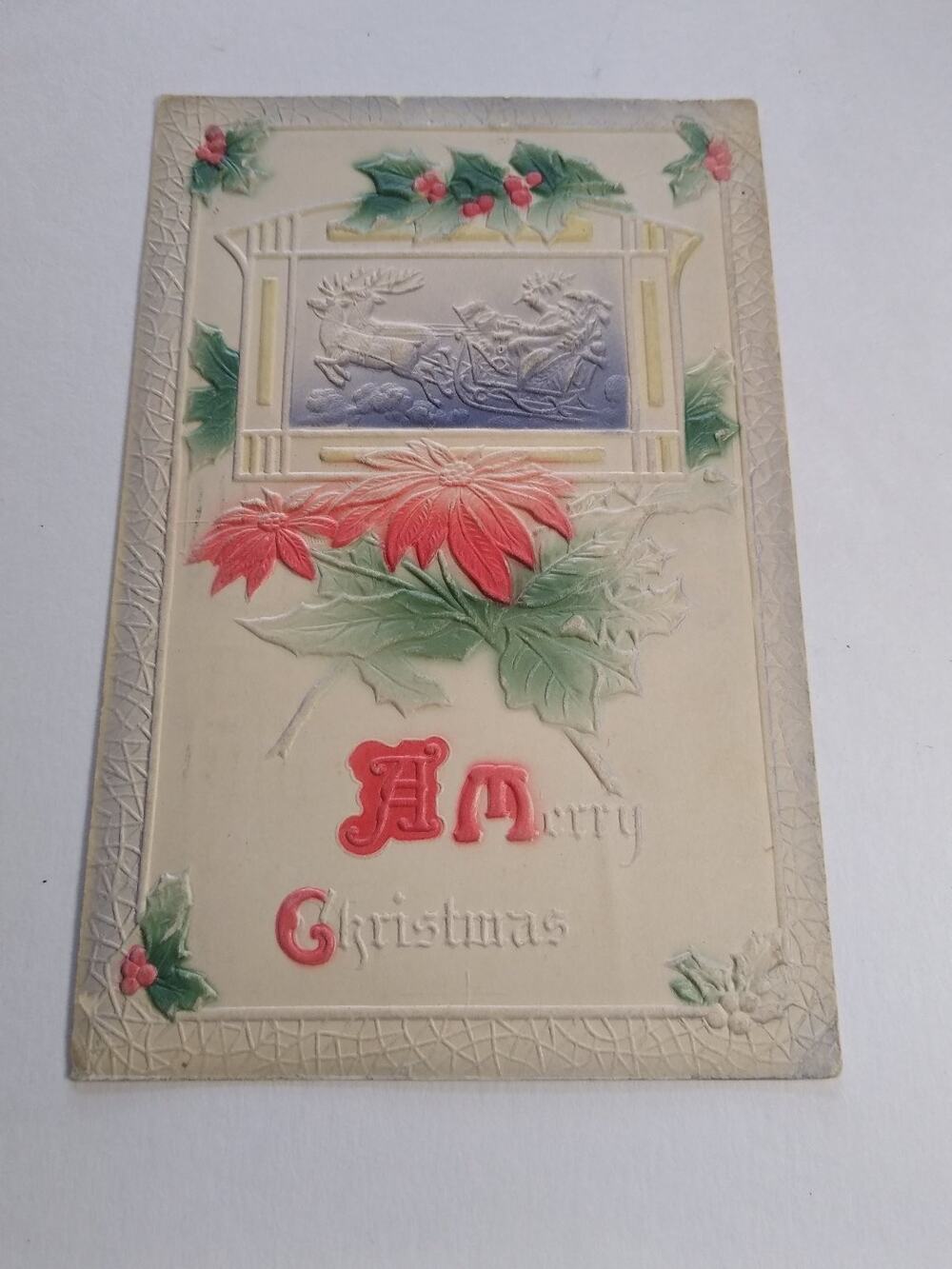 Antique Embossed Christmas Postcard Santa Sleigh Reindeer Poinsettia Holly